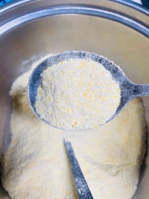 Put the fried rice, cornmeal, and glutinous rice into a food processor and grind them into a coarse powder. Don't grind it too finely (not as fine as glutinous rice flour or cornstarch). It tastes better with a bit of texture.