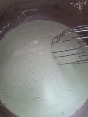 Put water, rice flour, tapioca flour, pandan paste (1/2 teaspoon) and salt into a pan. Stir until evenly mixed (water is cold) Cook using low heat while stirring. Stir until the mixture thickens.