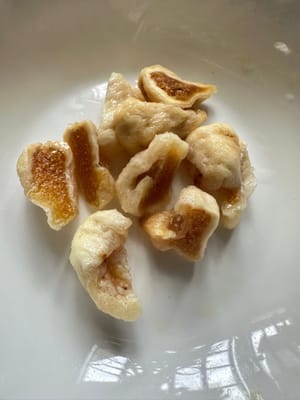 Also halve the red dates and dried figs