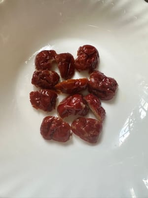 Also halve the red dates and dried figs