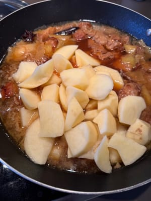 Add potatoes and bring to a boil over high heat, then reduce heat to low and simmer for 15 minutes.