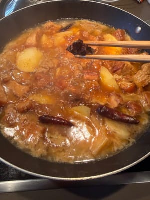 After 15 minutes, reduce the sauce over high heat, then remove the spices.