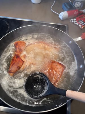 After the water boils, skim off the foam and remove the pork belly.