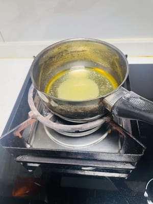 Heat the mixture in the small pot from step 4 on the stove until it melts and bubbles form.
