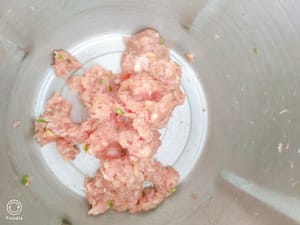 Add a little soy sauce, a little salt, a teaspoon of corn starch, and some chopped green onions to mix well.