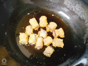 Heat oil in a pan, add the eggplant and fry slowly over low heat