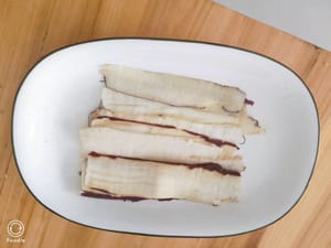 Cut the eggplant into thin rectangular slices without peeling it.