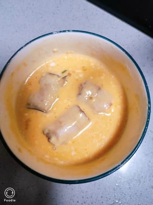 Coat the eggplant in batter.