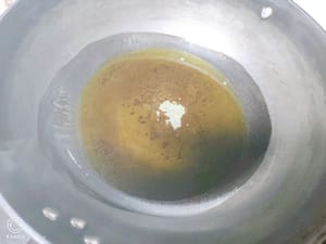 Heat oil in a pan, add the eggplant and fry slowly over low heat