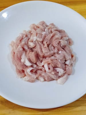 Slice the meat thinly and then cut into strips