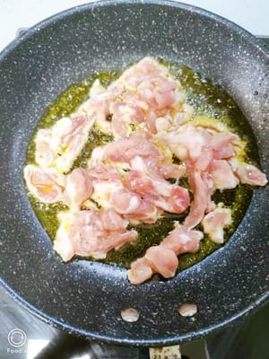 Heat the oil in a pan and add the prepared shredded pork